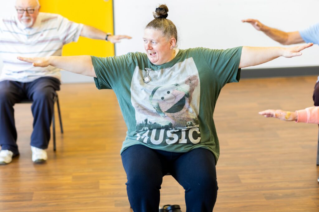 woman doing chair yoga