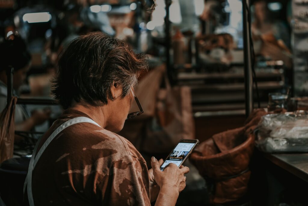  Hands holding a smartphone with a payment app open while a message pushes for quick action
