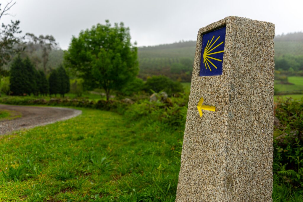 A Yellow Arrow on a podium on the Camino do Santiago