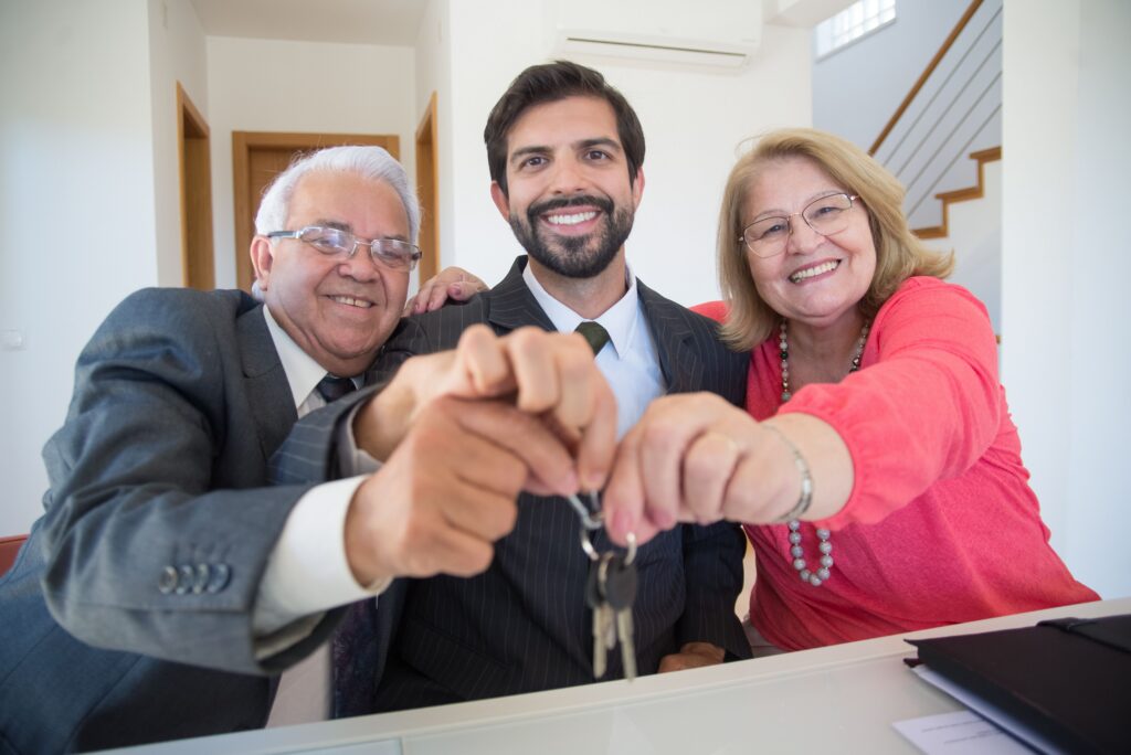 Couple getting the keys with their Realtor